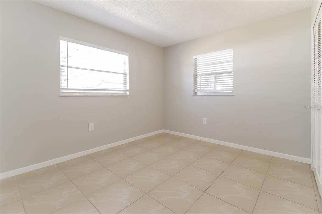 3014 Windchime Circle West Apopka, FL 32703 - Photo 13 of 16 an empty room with windows