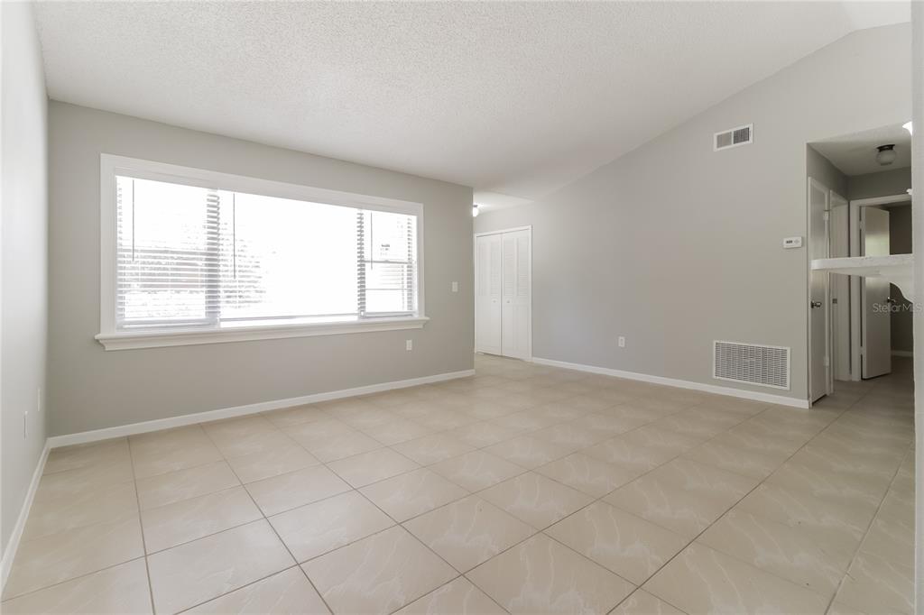 3014 Windchime Circle West Apopka, FL 32703 - Photo 3 of 16 an empty room with windows