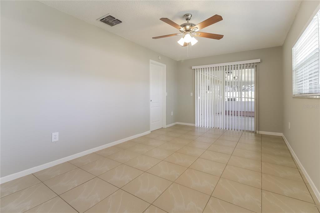 3014 Windchime Circle West Apopka, FL 32703 - Photo 9 of 16 a view of an empty room with a window
