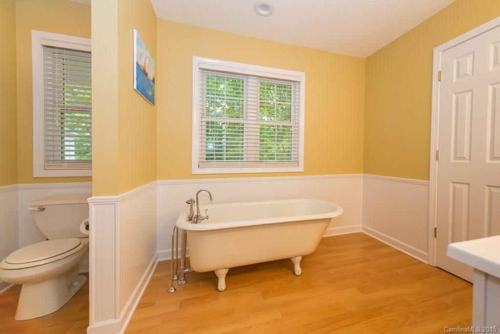 7218 Alexander Farm Road, Unit 3 B F Monroe, NC 28110 - Photo 14 of 24 a bathroom with a sink and a bath tub