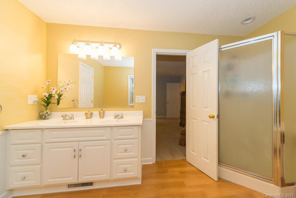 7218 Alexander Farm Road, Unit 3 B F Monroe, NC 28110 - Photo 15 of 24 a bathroom with a double vanity sink mirror and