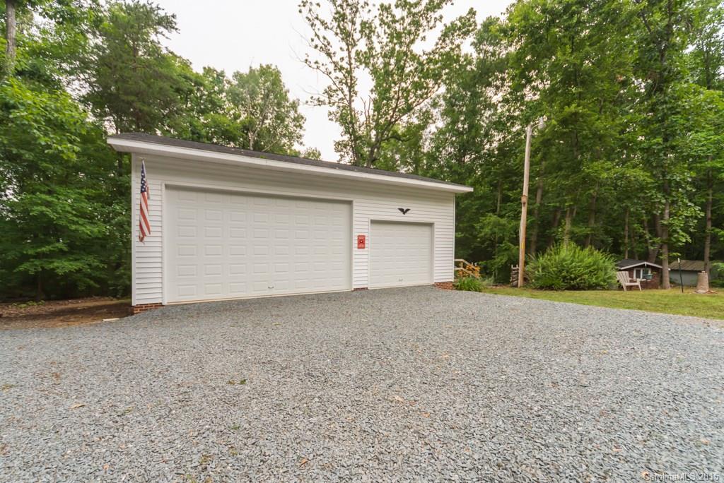 7218 Alexander Farm Road, Unit 3 B F Monroe, NC 28110 - Photo 19 of 24 a view of garage and yard
