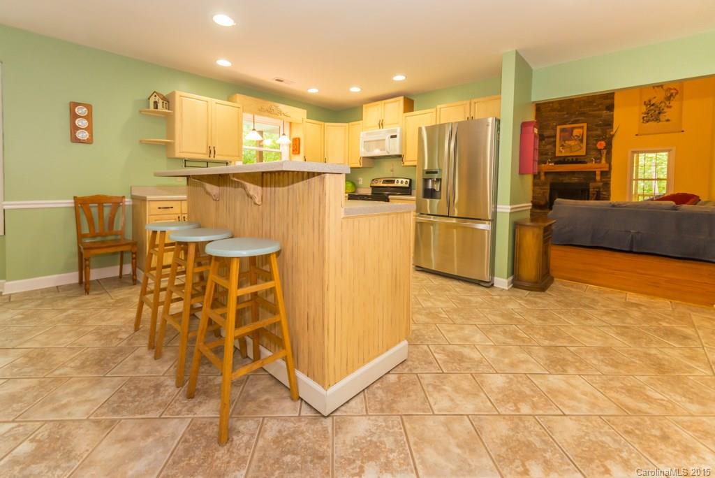 7218 Alexander Farm Road, Unit 3 B F Monroe, NC 28110 - Photo 7 of 24 a kitchen with stainless steel appliances a refrigerator and microwave