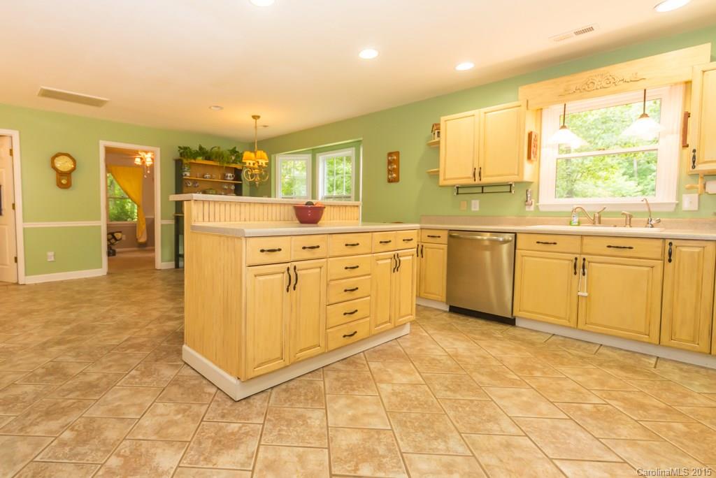 7218 Alexander Farm Road, Unit 3 B F Monroe, NC 28110 - Photo 8 of 24 a kitchen with stainless steel appliances granite countertop a sink and cabinets