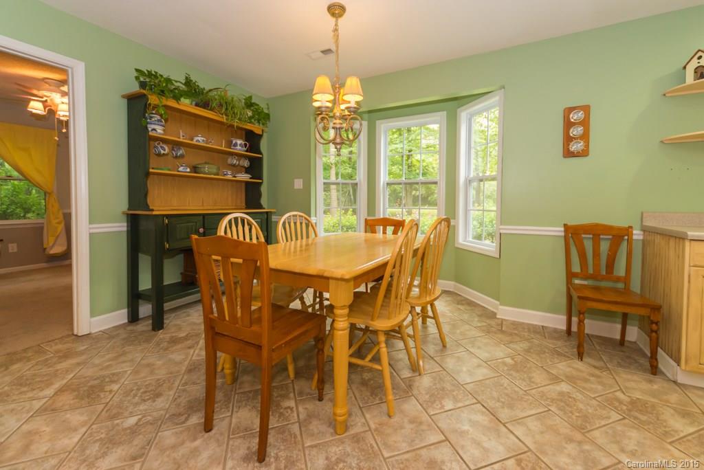 7218 Alexander Farm Road, Unit 3 B F Monroe, NC 28110 - Photo 10 of 24 a view of a dining room with furniture and window