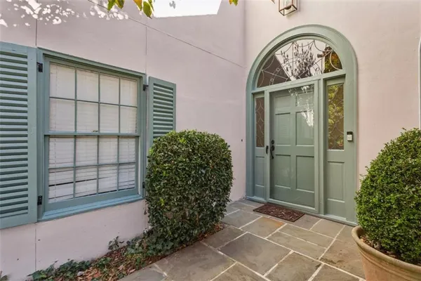 a view of a entryway door front of a house