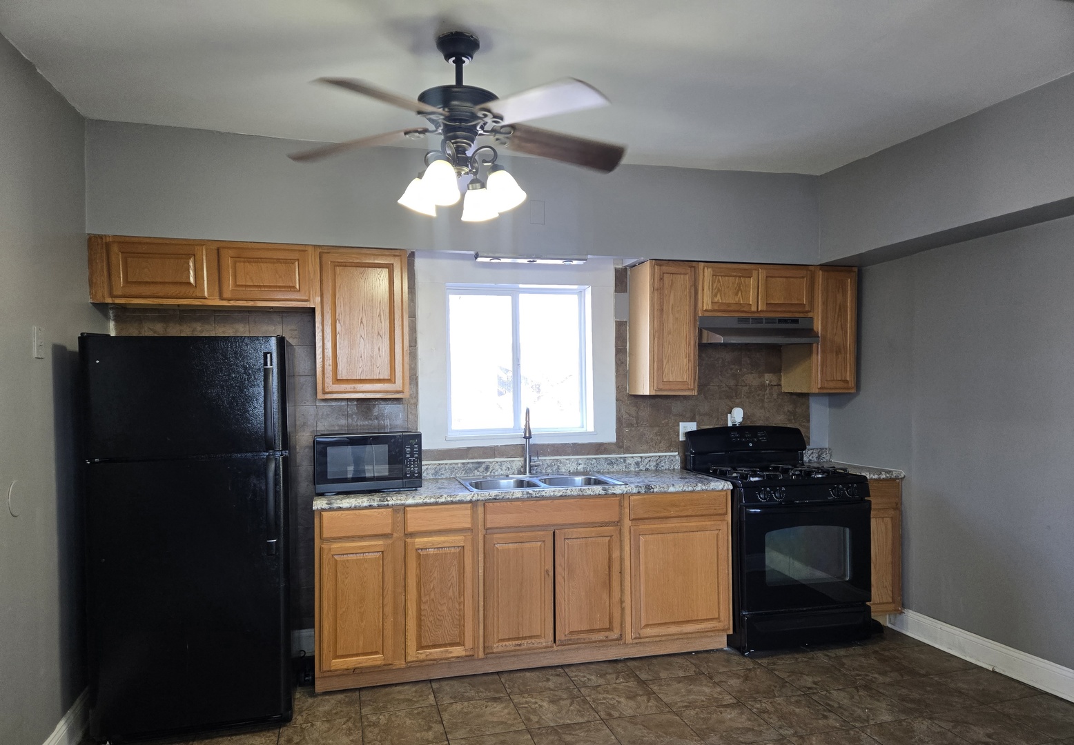 2822 West Marquette Road, Unit 2F Chicago, IL 60629 - Photo 14 of 17 a kitchen with a refrigerator and a sink