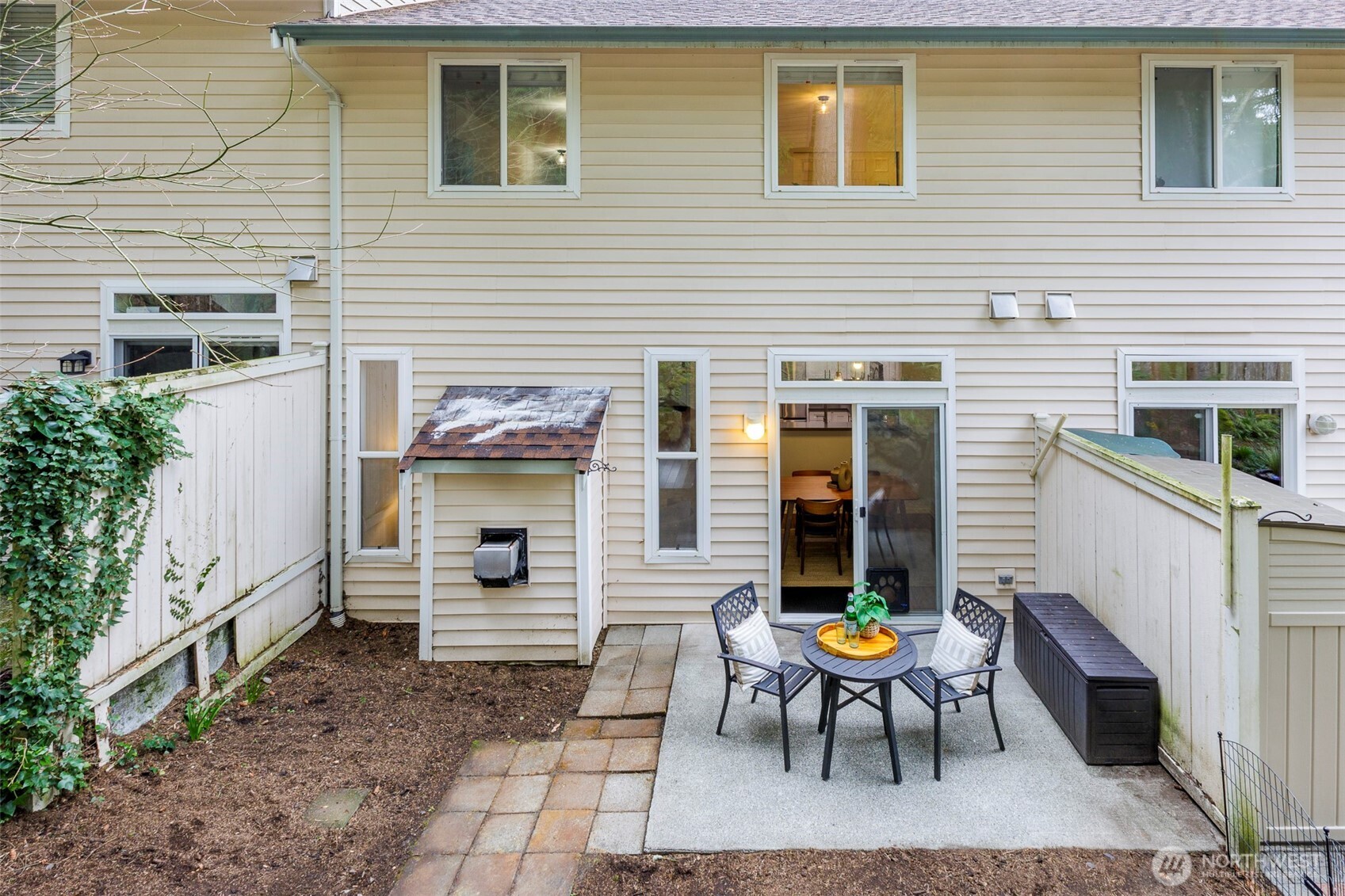 8828 238th Street Southwest, Unit C3 Edmonds, WA 98026 - Photo 11 of 29 a view of a brick house with a chairs in patio