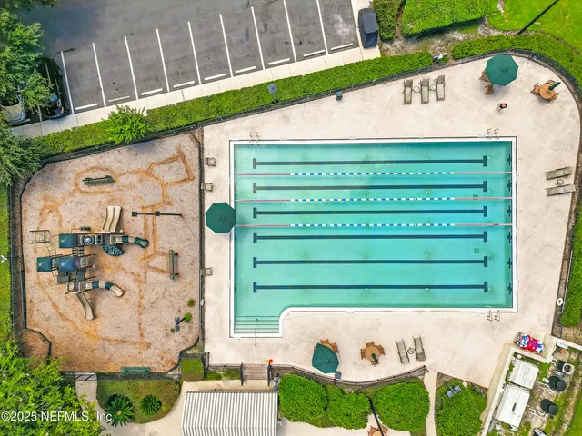 an aerial view of a golf course with parking space
