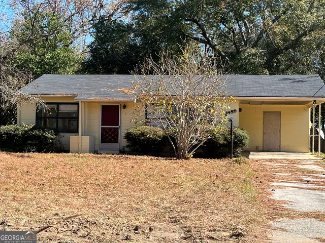 a view of a house with a snow in the yard