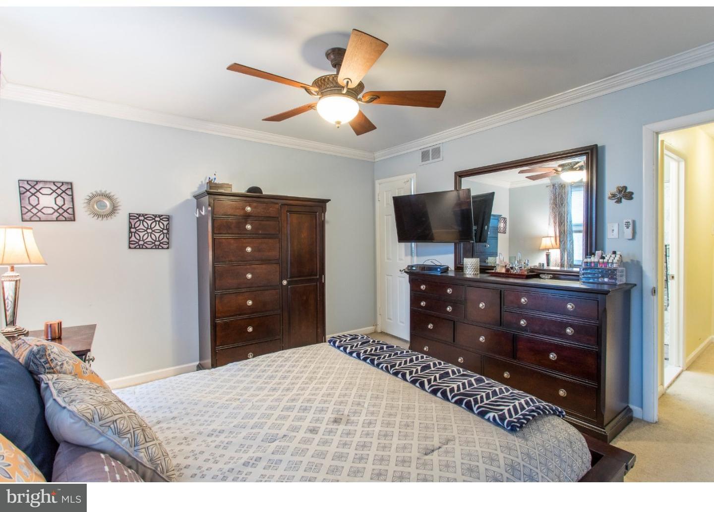 11902 Stevens Road Philadelphia, PA 19116 - Photo 11 of 21 a bedroom with a bed and a flat screen tv