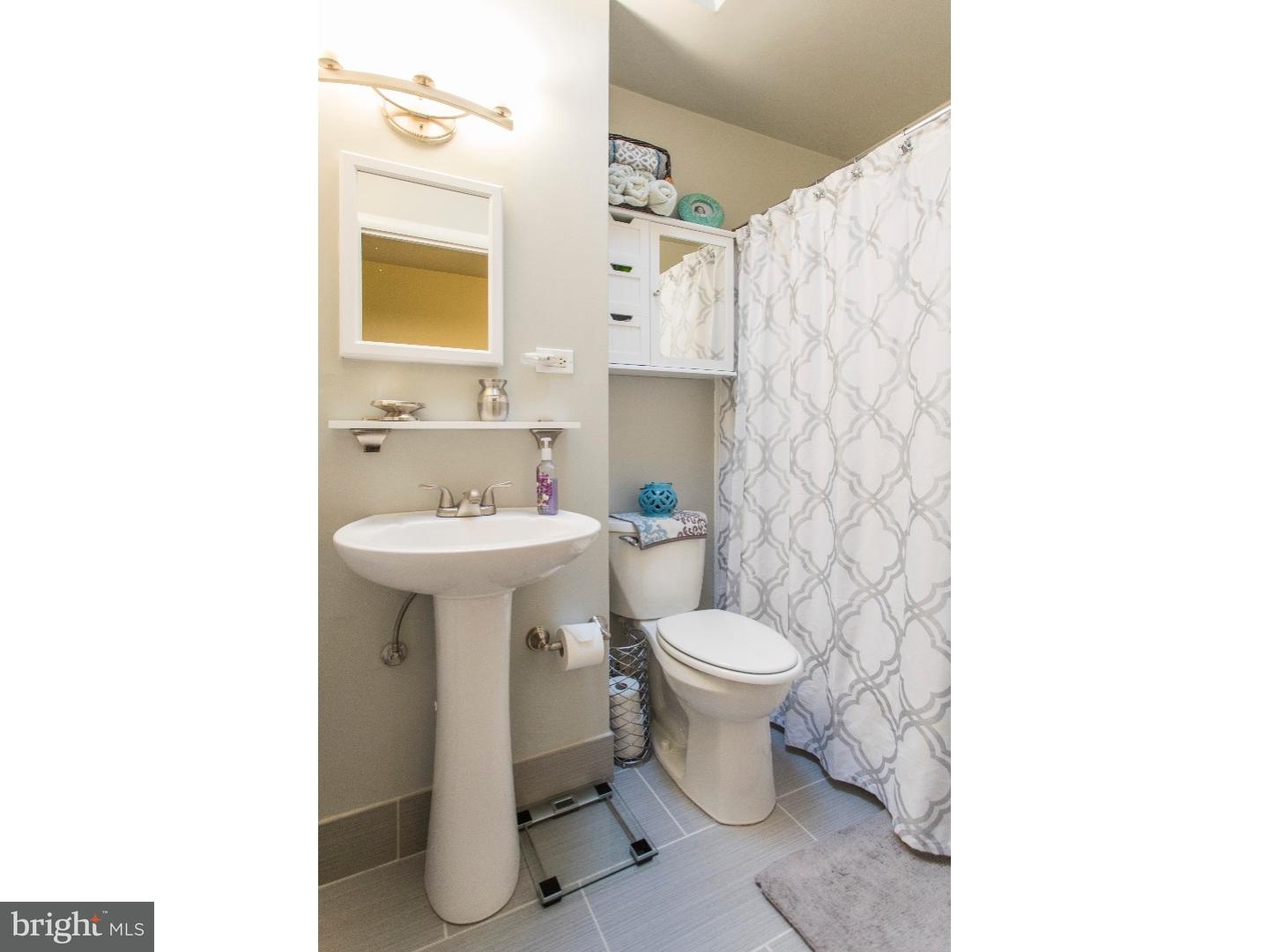 11902 Stevens Road Philadelphia, PA 19116 - Photo 13 of 21 a bathroom with a sink toilet and shower