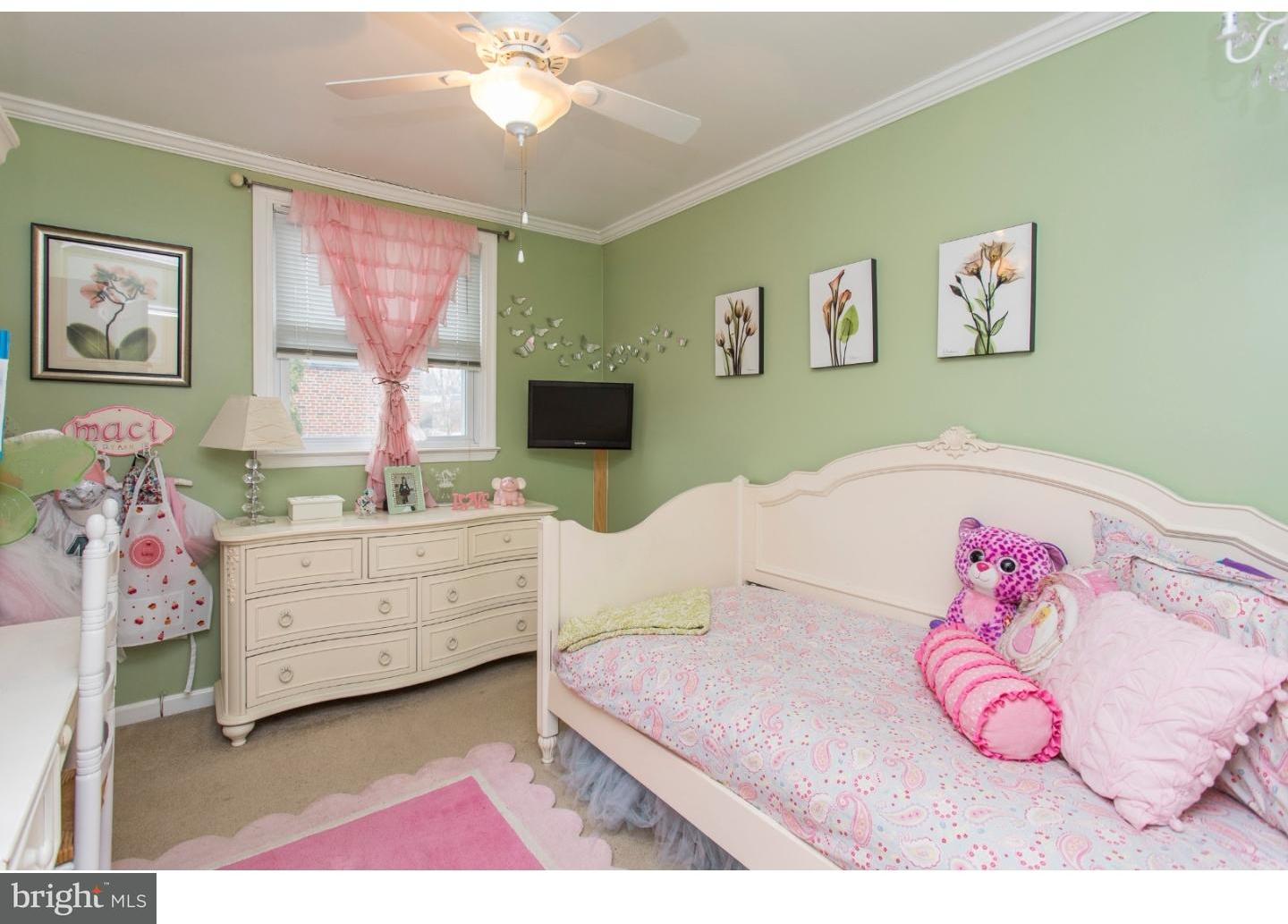 11902 Stevens Road Philadelphia, PA 19116 - Photo 14 of 21 a bedroom with a bed and a mirror
