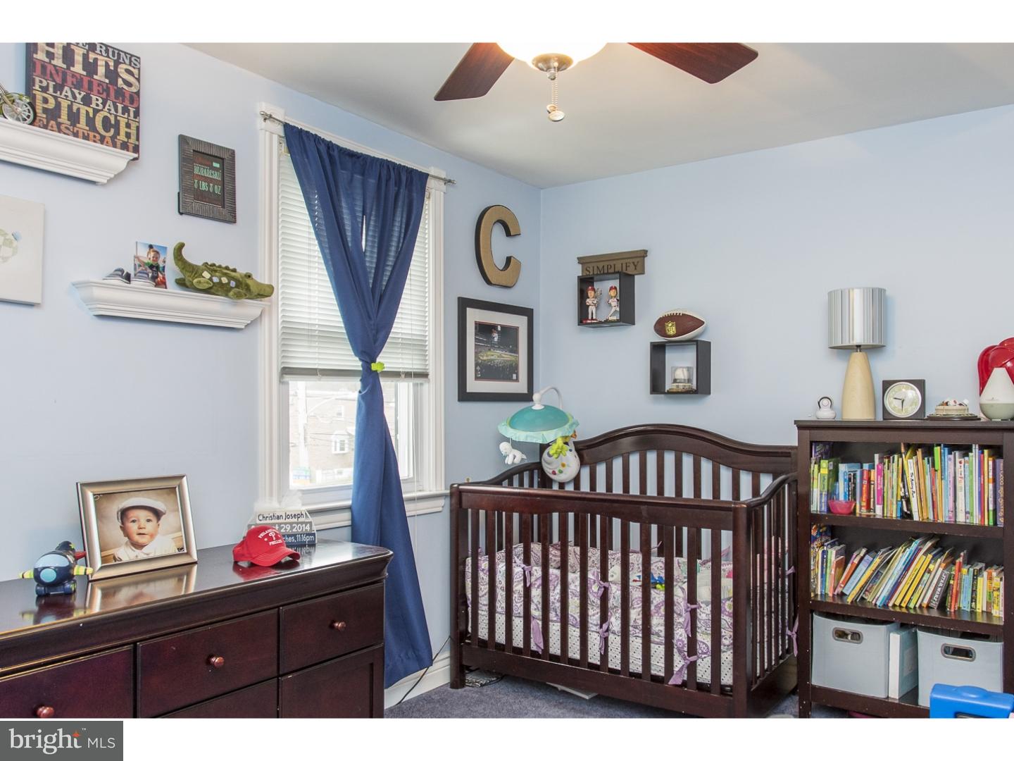 11902 Stevens Road Philadelphia, PA 19116 - Photo 17 of 21 a bedroom with furniture a rug and a book shelf