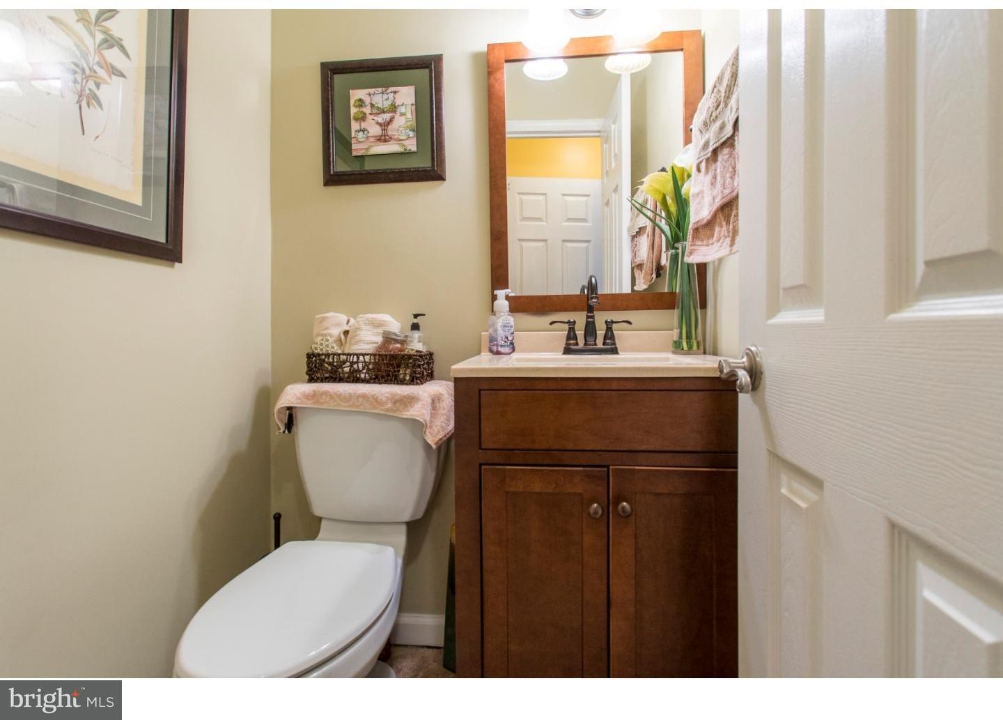 11902 Stevens Road Philadelphia, PA 19116 - Photo 18 of 21 a bathroom with a toilet a sink and a mirror