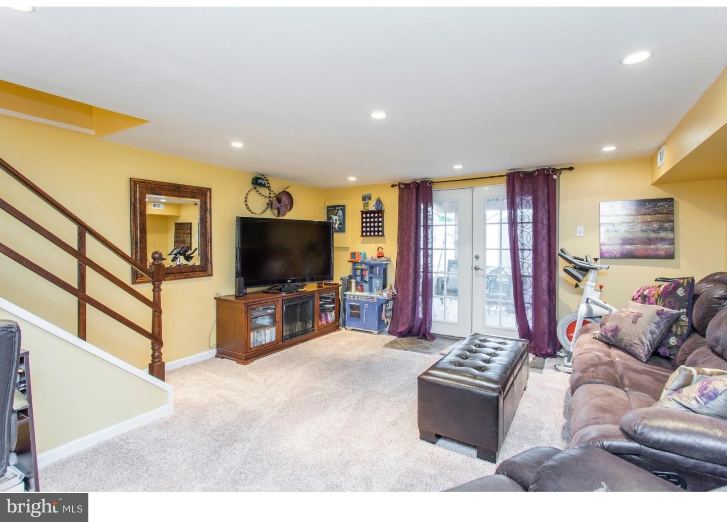 11902 Stevens Road Philadelphia, PA 19116 - Photo 20 of 21 a living room with furniture and a flat screen tv