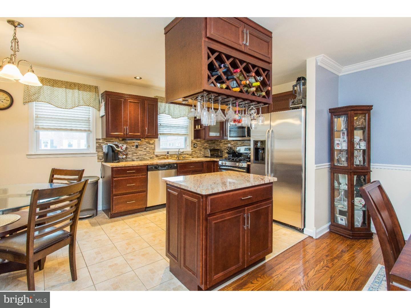 11902 Stevens Road Philadelphia, PA 19116 - Photo 4 of 21 a kitchen with a stove top oven and refrigerator