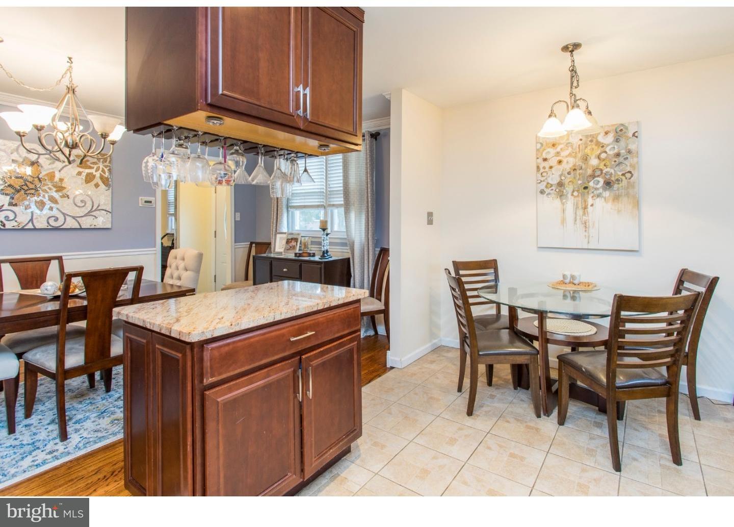 11902 Stevens Road Philadelphia, PA 19116 - Photo 7 of 21 a dining room with a wooden table and chairs