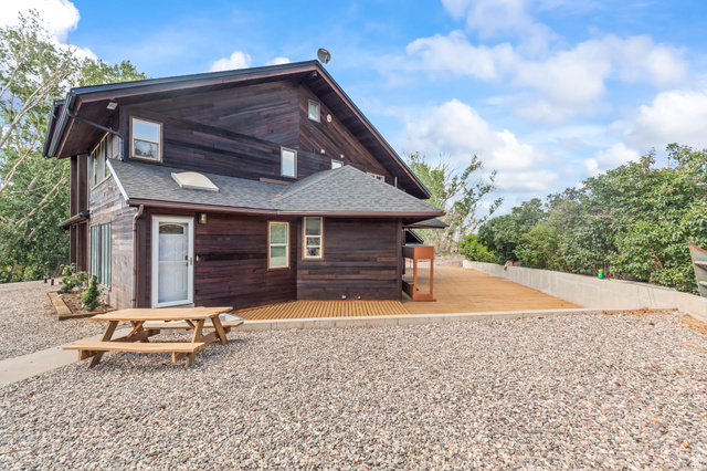 460 Omni Point Road Central Valley, UT 84754 - Photo 67 of 101 Multi-level wood-sided exterior featuring a gabled roof and white-framed windows