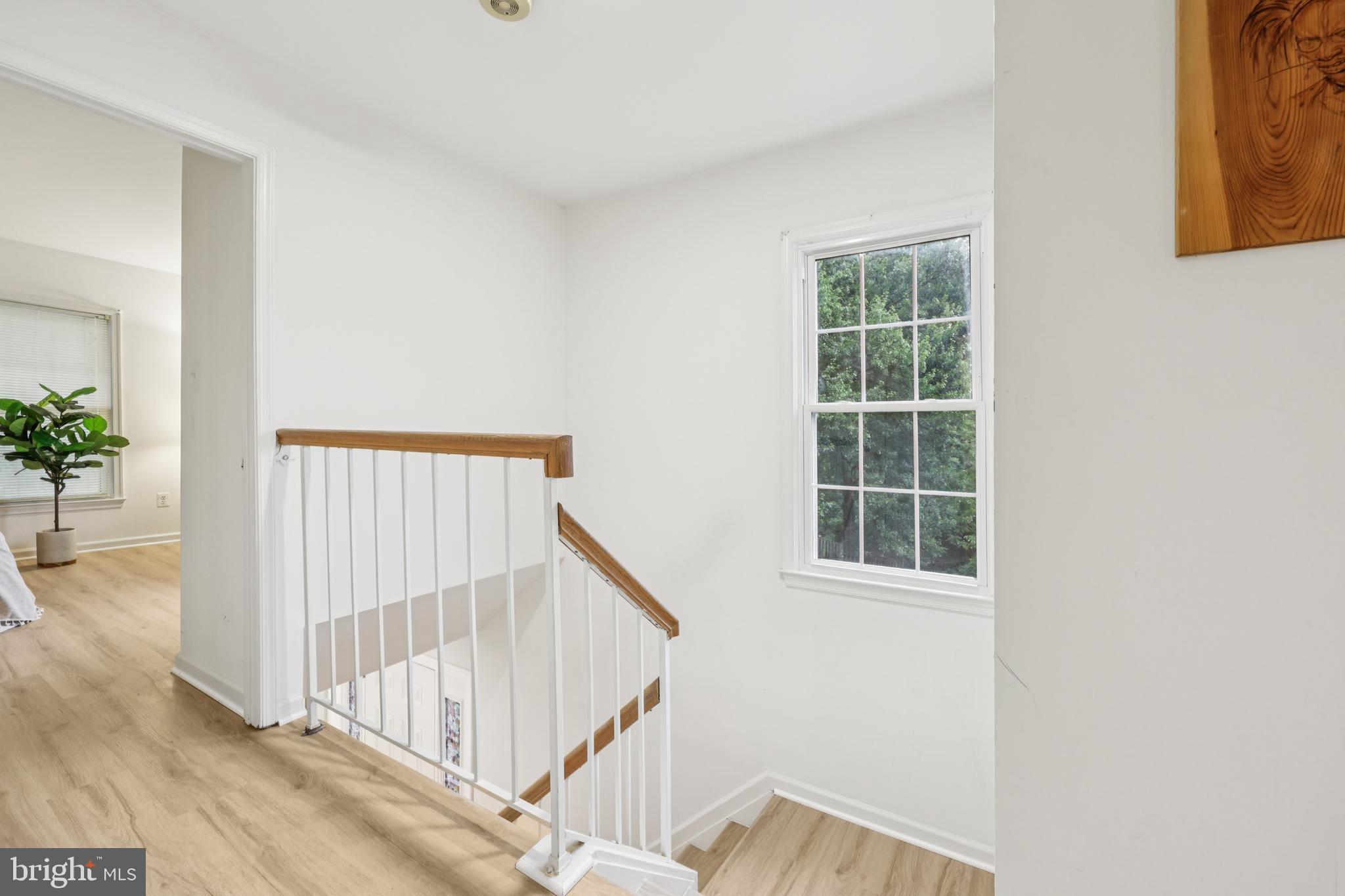 8536 Springfield Oaks Drive Springfield, VA 22153 - Photo 16 of 34 Stairwell is bright and airy