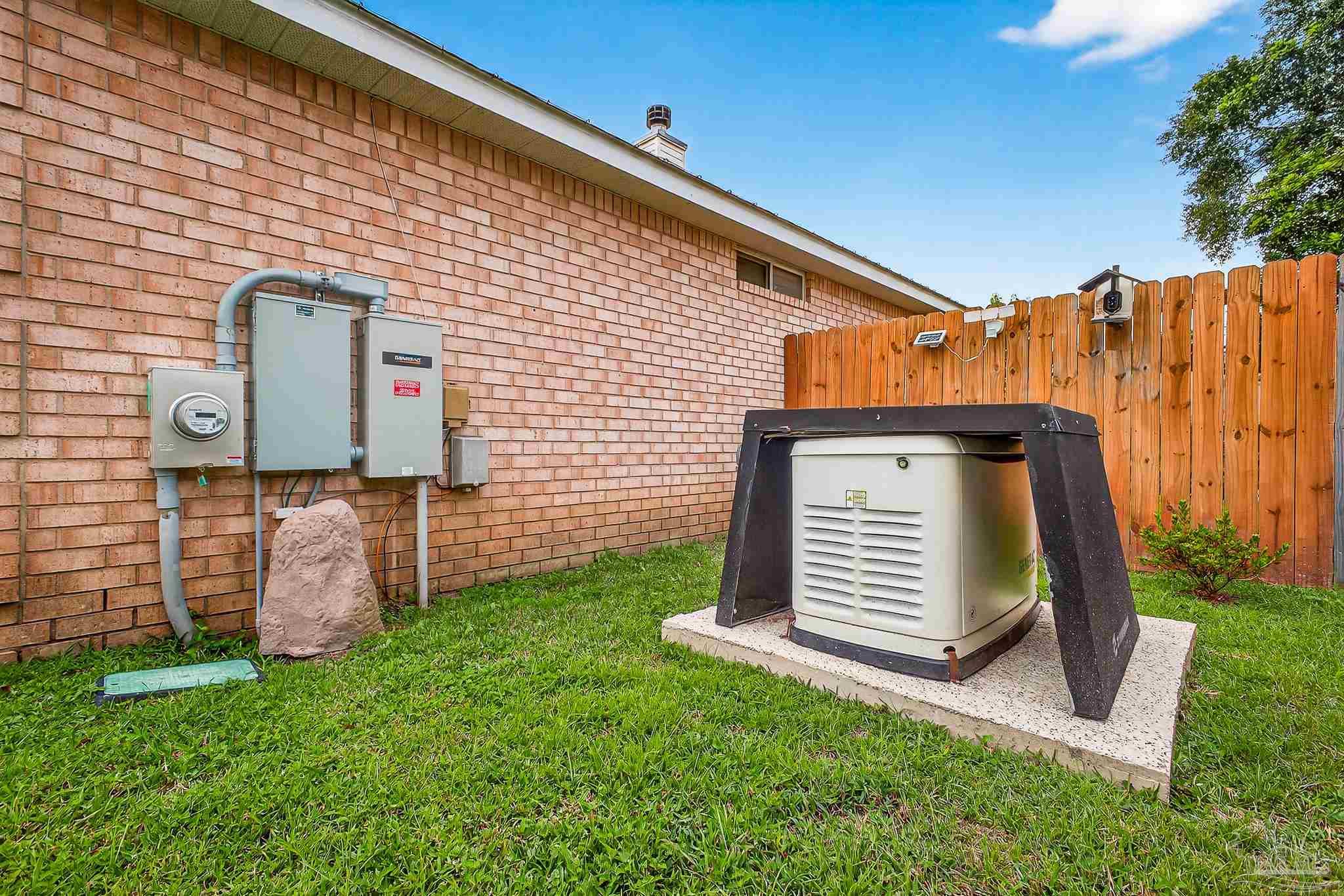 10051 Bristol Park Road Cantonment, FL 32533 - Photo 20 of 60 a backyard of a house with lots of green space