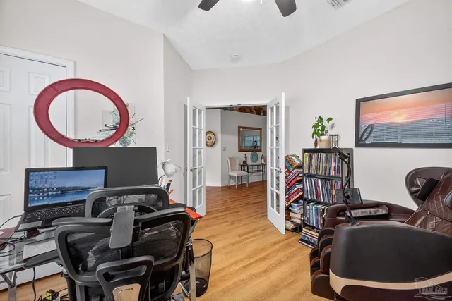 a spacious bathroom with a granite countertop sink mirror and shower