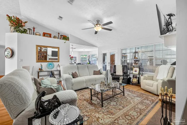 a kitchen with stainless steel appliances granite countertop a refrigerator and a stove