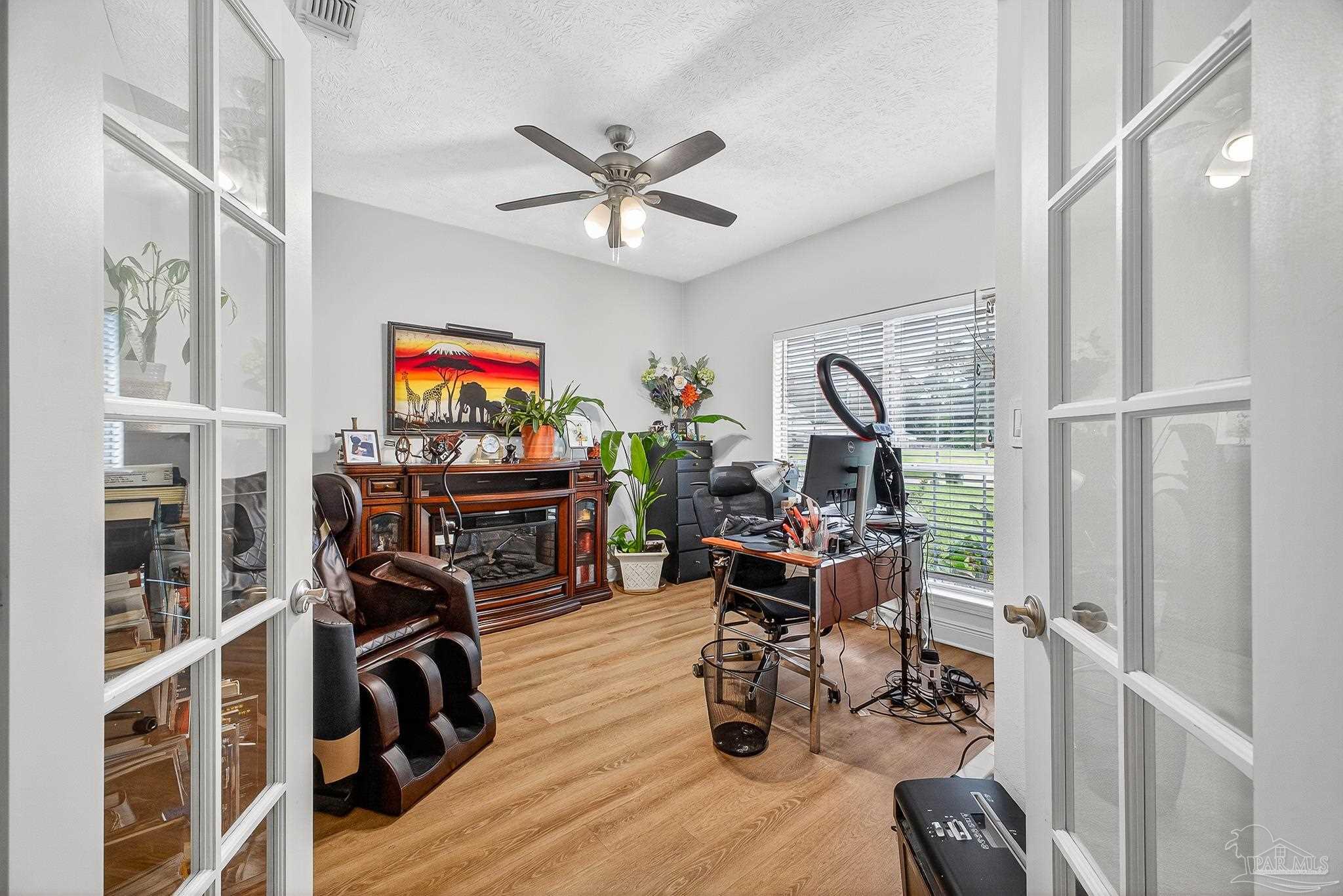 10051 Bristol Park Road Cantonment, FL 32533 - Photo 36 of 60 a view of a workspace with furniture entryway and wooden floor