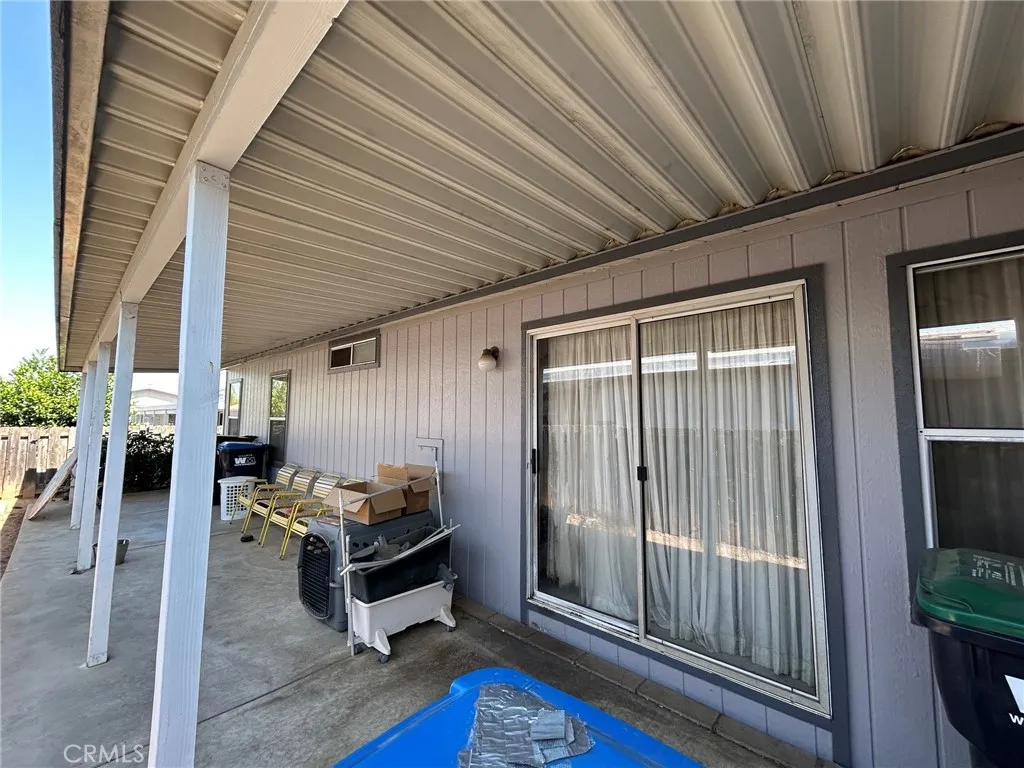 27250 Murrieta Road, Unit 347 Menifee, CA 92586 - Photo 36 of 43 sideyard covered Pati