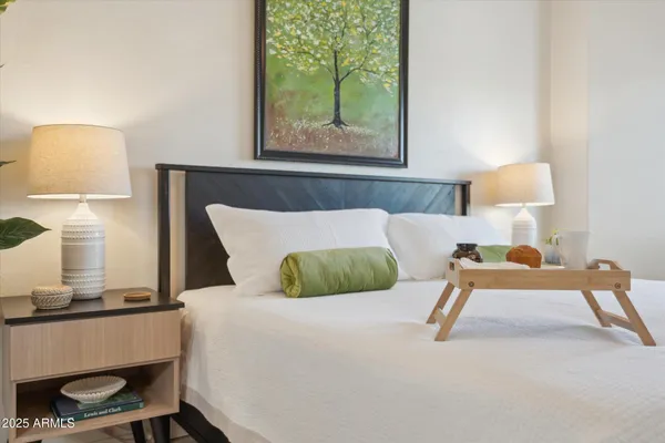 a bed room with a bed and a lamp