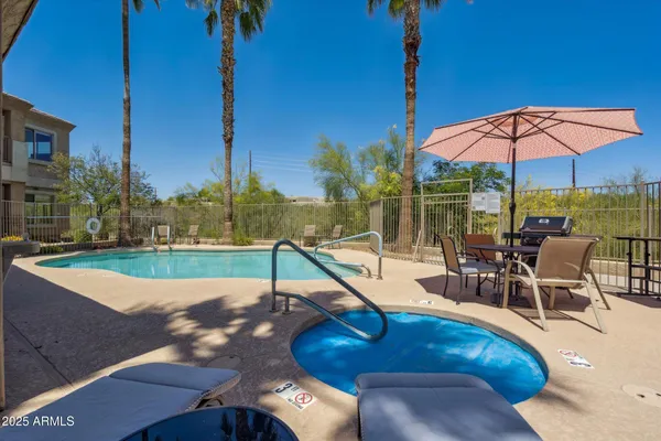 a view of a swimming pool with a patio