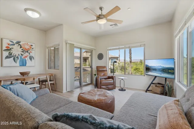 a living room with furniture and a large window
