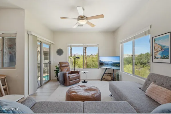 a living room with furniture and a large window