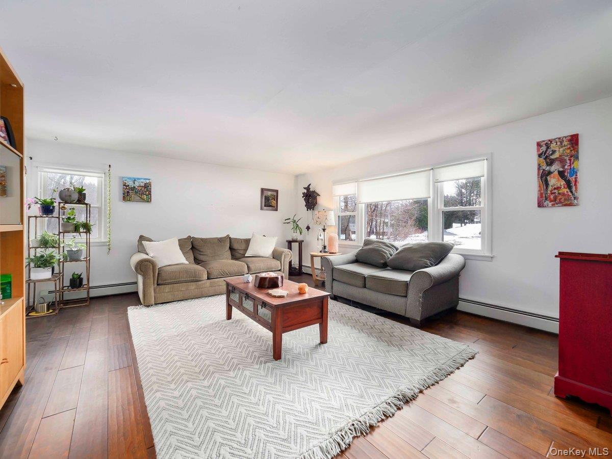 14 Harrigan Road Hopewell Junction, NY 12533 - Photo 11 of 45 a living room with furniture and a wooden floor