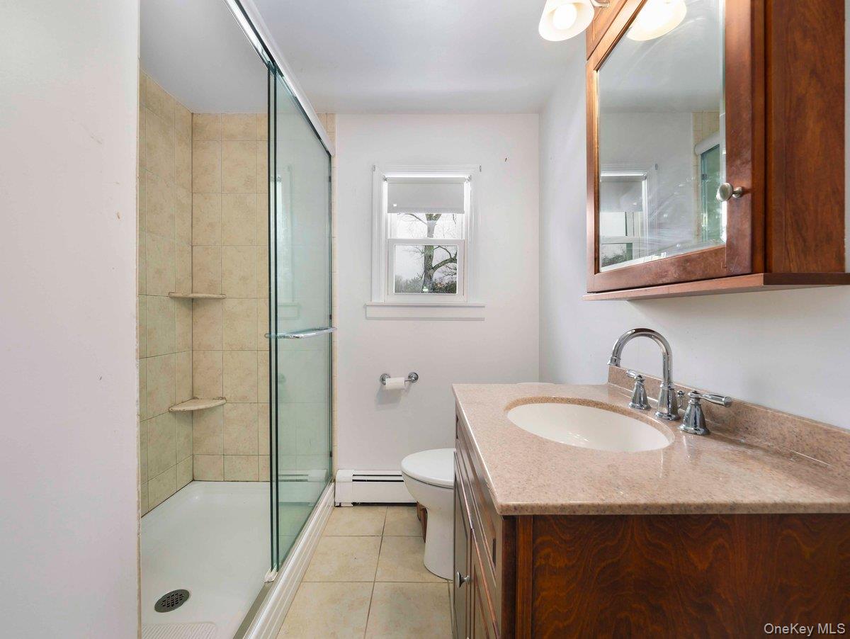 14 Harrigan Road Hopewell Junction, NY 12533 - Photo 14 of 45 a bathroom with a sink a toilet and shower