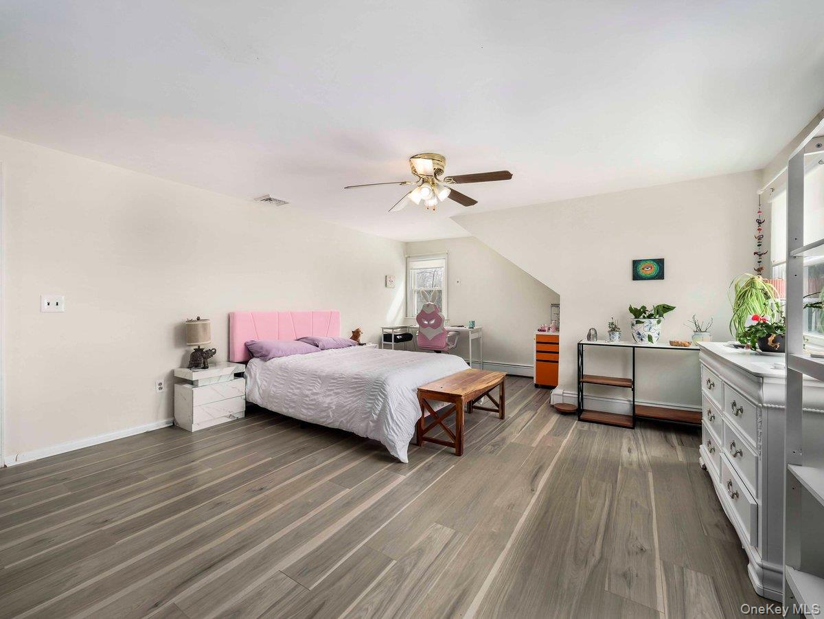 14 Harrigan Road Hopewell Junction, NY 12533 - Photo 15 of 45 a spacious bedroom with a bed and wooden floor