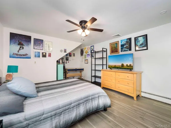 a bedroom with a bed and a dresser