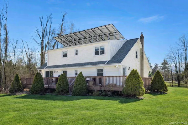 a view of a back yard of the house