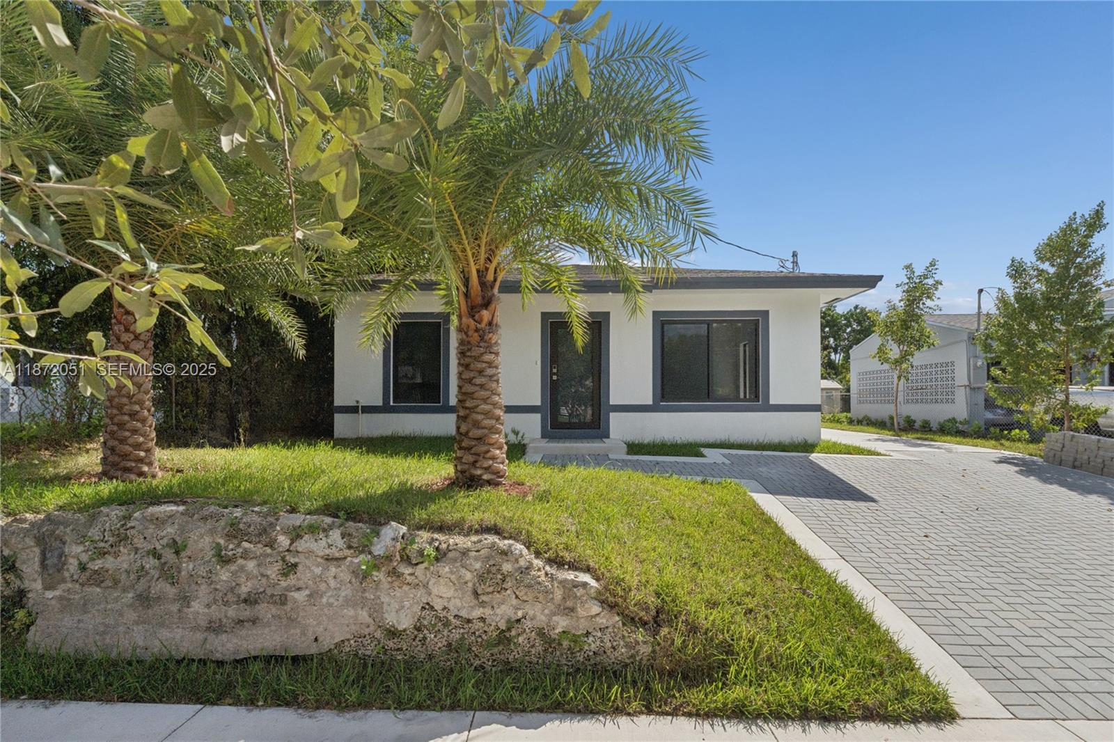 front view of a house with a yard