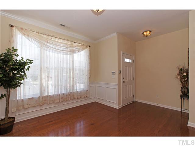 7848 Spungold Street Raleigh, NC 27617 - Photo 2 of 21 a view of wooden floor and windows in a room