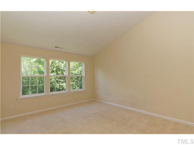 7848 Spungold Street Raleigh, NC 27617 - Photo 9 of 21 a view of an empty room with a window