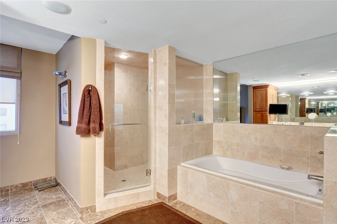 360 East Desert Inn Road, Unit 801 Las Vegas, NV 89109 - Photo 20 of 44 Primary bathroom with separate tub/shower.