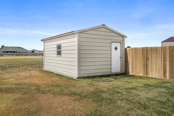 a view of a backyard of a house
