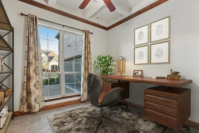 a room with chandelier fan and windows