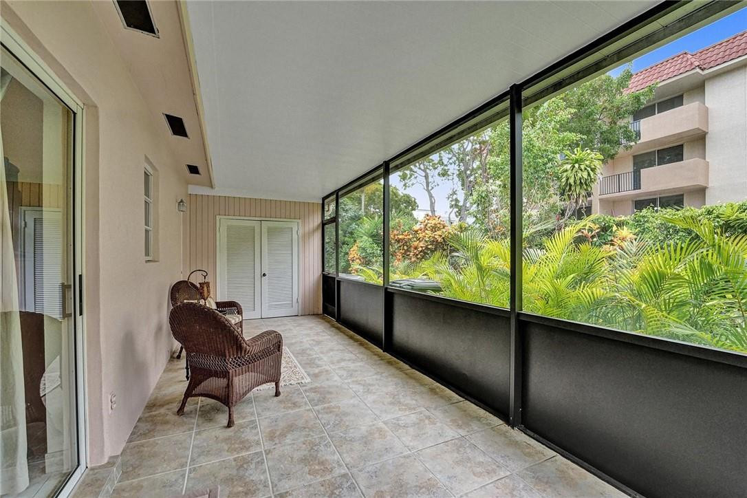770 East Camino Real, Unit 3 Boca Raton, FL 33432 - Photo 16 of 34 a living room with furniture and a large window