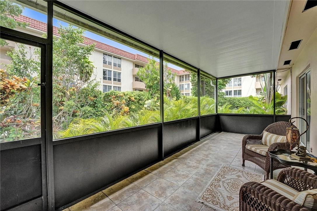 770 East Camino Real, Unit 3 Boca Raton, FL 33432 - Photo 17 of 34 a living room with large windows
