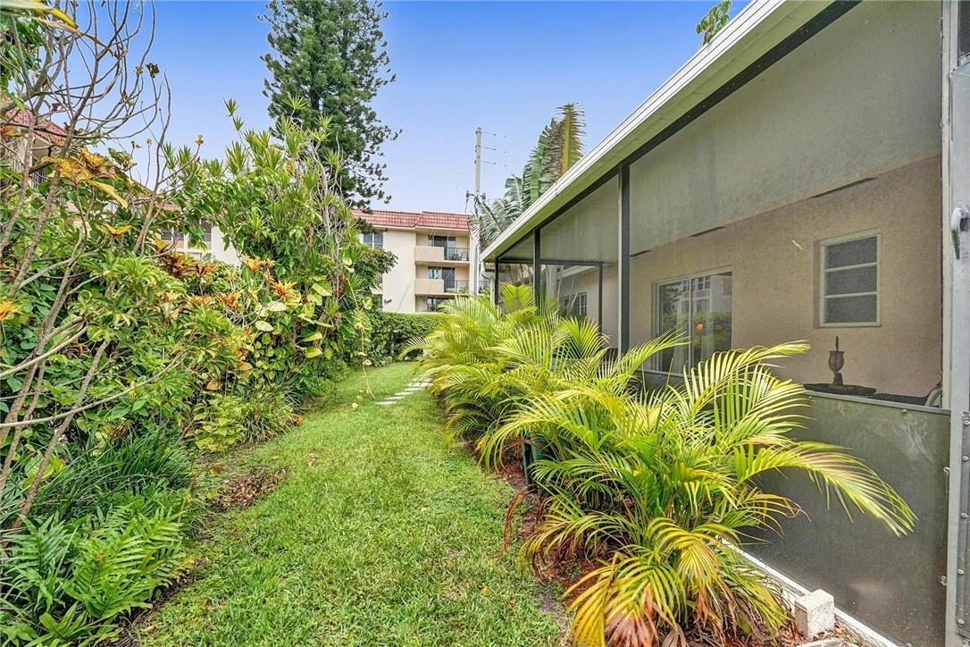 770 East Camino Real, Unit 3 Boca Raton, FL 33432 - Photo 19 of 34 a view of a back yard of the house