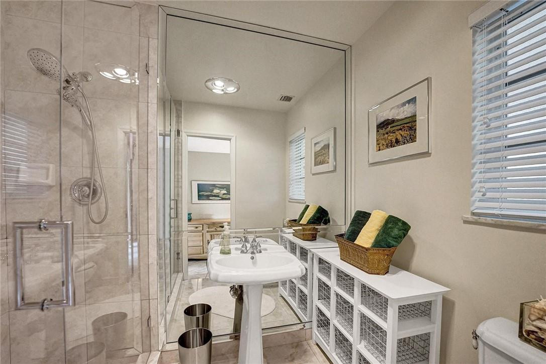 770 East Camino Real, Unit 3 Boca Raton, FL 33432 - Photo 24 of 34 a bathroom with a sink and mirror