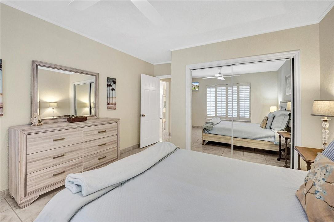 770 East Camino Real, Unit 3 Boca Raton, FL 33432 - Photo 27 of 34 a bedroom with a bed and a mirror