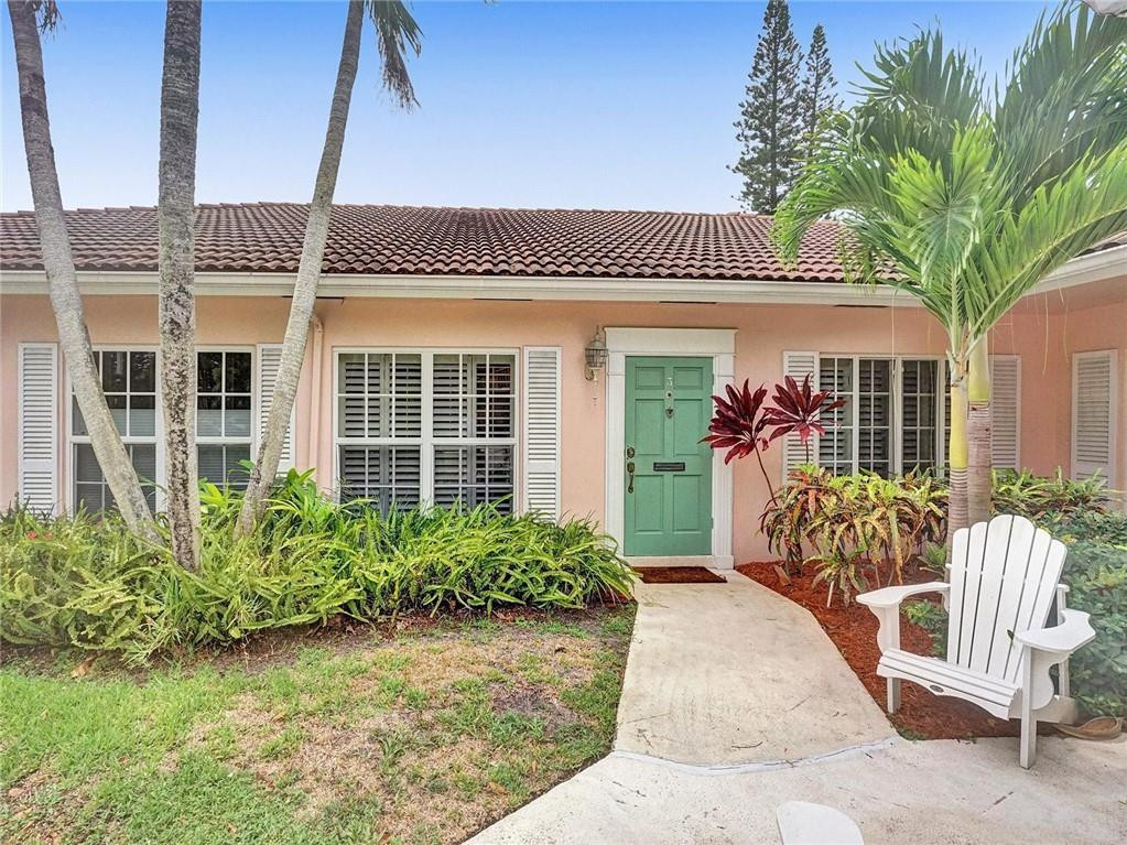 770 East Camino Real, Unit 3 Boca Raton, FL 33432 - Photo 3 of 34 a front view of a house with garden